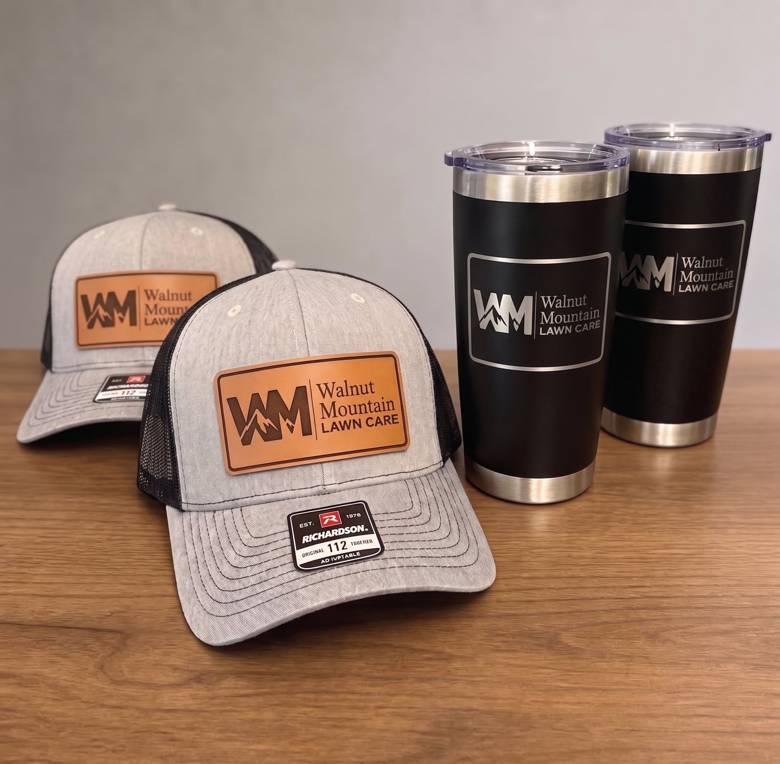 Walnut Mountain Lawn Care hats and tumblers